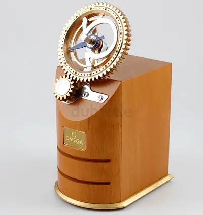 Omega branded decorative mechanical gear clock in wooden case