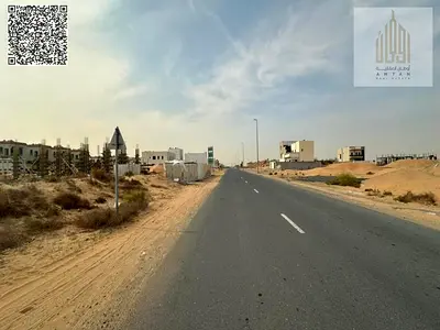 Residential investment land in Al Helio 1, located on a main road, with excellent features making it an ideal choice for investors or for future const