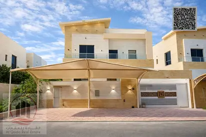 Villa for sale in Ajman, Al Yasmin area, including electricity, water, and air conditioning. It consists of 5 master bedrooms, a majlis (formal sittin
