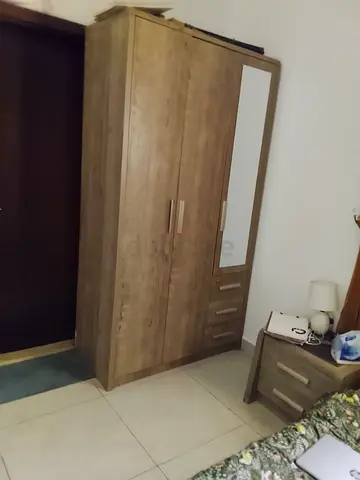 3-door wooden wardrobe with mirror and drawers - good condition