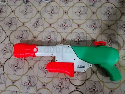 Used colorful water blaster toy - good working condition