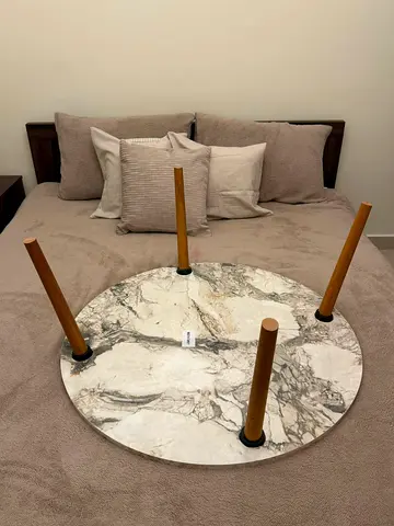 Small round coffee table with wooden legs (pan home)