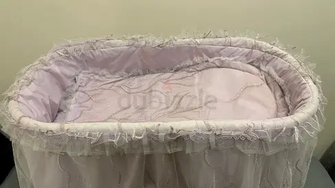 Elegant Pink Baby Bassinet with Lace Trim