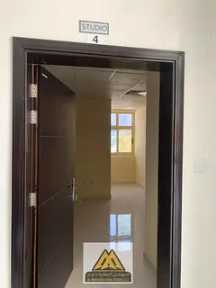 A modern studio apartment for annual rent in Al Alia, Ajman. The property features a practical desig