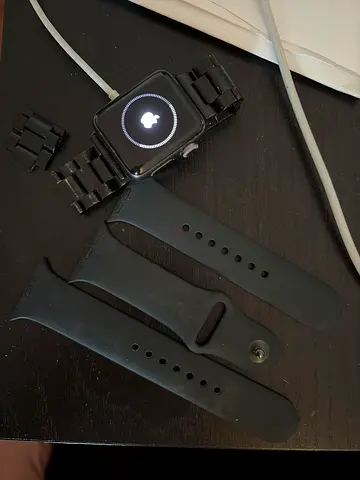 Apple Watch Series 2 (black) with original black silicone bands and metal link strap - used.