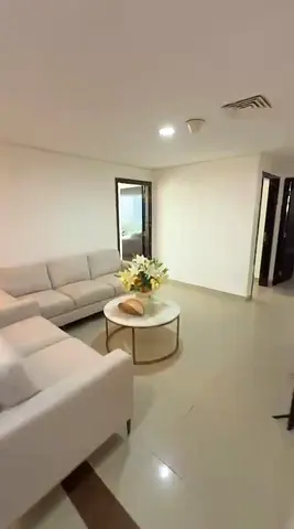 Three bedrooms and a living room for annual rent with a parking space, gym, and swimming pool in the tower for 60,000