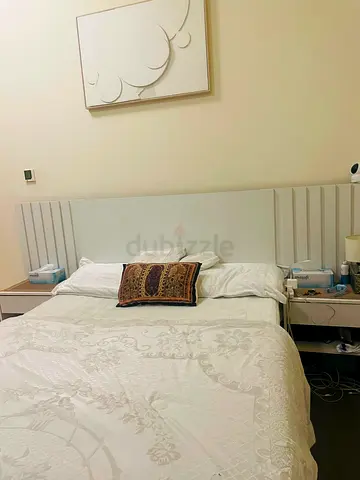 Modern white single bed with attached bedside table - good condition