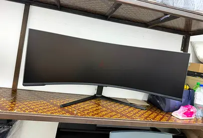 The Samsung S57CG952N (often branded as the Odyssey Neo G9 G95NC) is a massive 57-inch super-ultrawi
