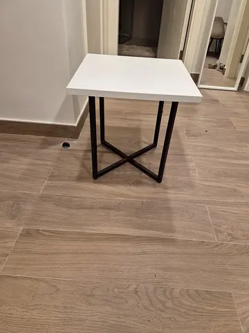 Perfect condition. Small modern side/end table with white wooden top and black metal legs.50cmx50x50