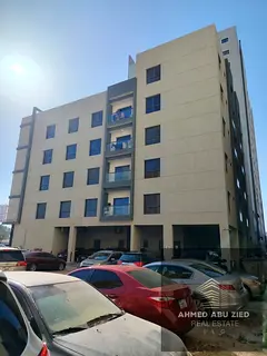 Investment building for sale in Al Hamidiya, Ajman, prime location opposite Etisalat Tower, annual i