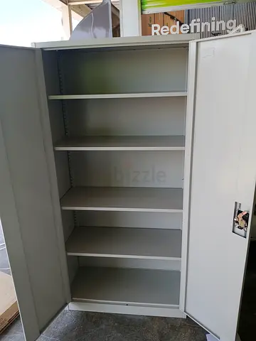 Tall White Storage Cabinet with Multiple Shelves - Good Condition