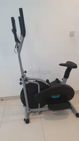 Used upright exercise bike with handles and seat - good working condition