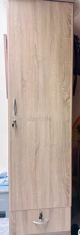 Tall freestanding wardrobe/cupboard in light oak finish - good condition