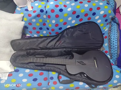 matte black acoustic-electric guitar with gig bag - excellent condition,