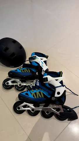Used inline roller skates with helmet - size adjustable, good condition