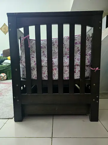 Solid dark wood baby crib - sturdy and in good condition