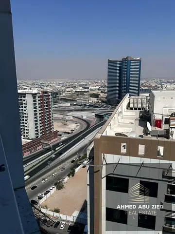 A spacious 3-bedroom apartment with a living room, private parking, and central air conditioning is available for annual rent in The Pearl Towers. It