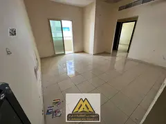 For rent: 2-bedroom apartment with hall in Al Rashidiya 2, Ajman. Balcony, 2 bathrooms, central AC,