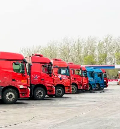 Fleet of Heavy-Duty Freight Trucks - Well-Maintained Line of Tractors and Trailers