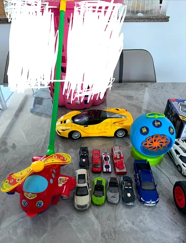 Lot of kids toy cars and ride-on helicopter - used .Remotes not available