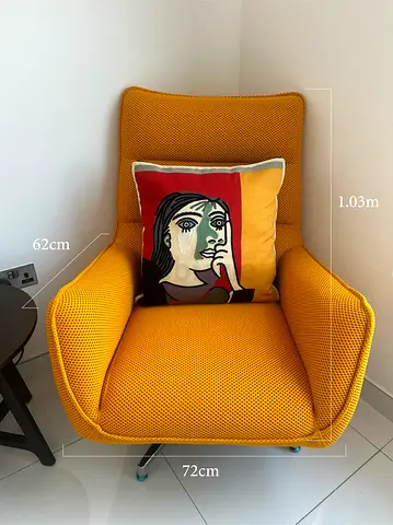 Mustard yellow swivel lounge chair with cushion