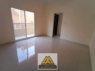 A one-bedroom apartment with a living room for annual rent in Al Rawda 1, Ajman, first-time occupant, in a prime location close to all services and ba