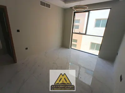 First-occupant apartment in Al Hamidiya 1, Ajman. One bedroom and living room, 2 bathrooms, master room, balcony with view, central AC, maintenance co