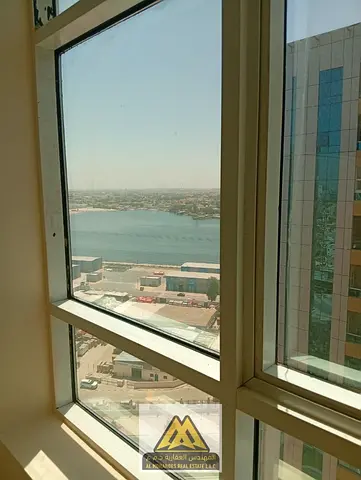 A spacious one-bedroom apartment with a living room in the Orient Towers, Al Bustan area, close to Ajman Corniche and all services.
