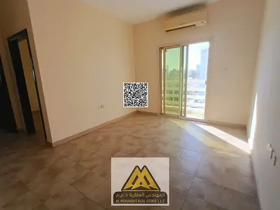 Spacious apartment with a balcony and open view in a vibrant location in Al Rashidiya, close to all amenities, at an affordable price