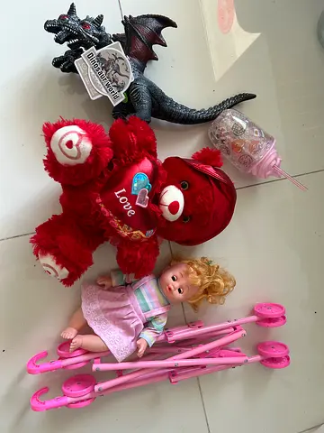 Mixed lot: Teddy bear, baby doll, dragon figure, stroller parts  sippy cup