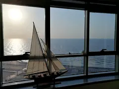 A luxurious two-bedroom apartment with a living room in the Ajman Corniche Towers, boasting the larg