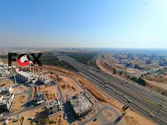 2 bedroom hall apartment for annual rent in Emirates City Lavender Tower parking gym pool flexible p