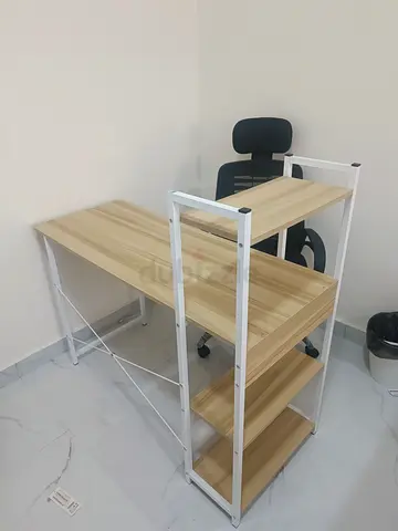 L-shaped wooden study desk with built-in shelving (like new)