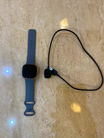 Fitbit Versa 4, in perfect condition, comes with charger and blue watch strap