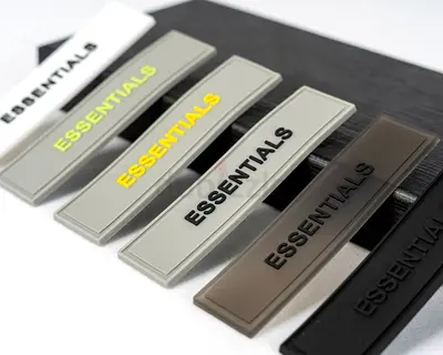 ESSENTIALS rubber logo patches — set of 5 brand labels