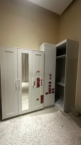 Used white 2 wardrobe / Corner closet with shelves and hanging rail — good condition