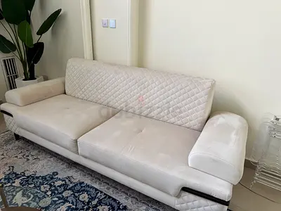 2 Elegant Cream Velvet Sofas with Quilted Sides