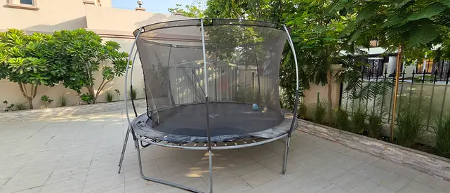 Used round Trampoline with Safety Net — Good Condition