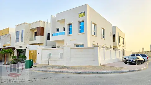 Corner villa for sale in Ajman | 4 master bedrooms, living room, majlis, maid's room | Private parking | Includes electricity, water, and registrati