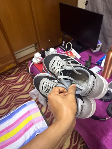 White and black casual sneakers, lightly used