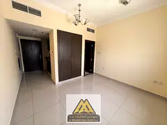 Annual studio for rent in Al Rawda 1, Ajman. Spacious layout, separate kitchen, built-in wardrobes,