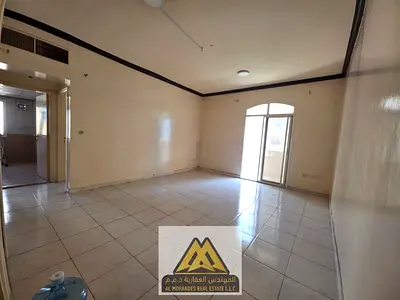Affordable prices in Ajman: spacious bedroom and living room, balcony, bathroom, built-in wardrobes, central air conditioning, and free parking next t