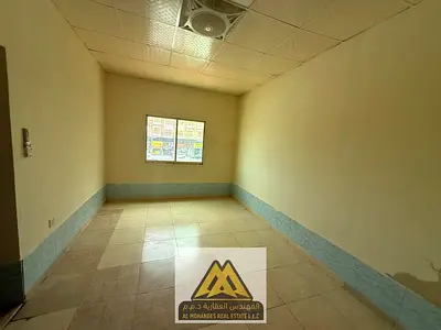 Studio in Al Mowaihat 3 with separate kitchen and split AC. AED 18K yearly, 4 payments, near Dubai and Sharjah, free maintenance, prime location, read