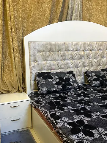 White upholstered bed with matching bedside drawer - good condition