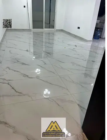 For rent: 1-bedroom apartment with hall in Al Mowaihat 3, Ajman, new building, master bedroom, 2 bathrooms, balcony, and excellent finishing.