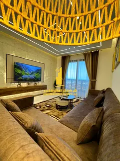 Luxury apartment for monthly rent, two bedrooms and a hall with a sea view, fully furnished with hig
