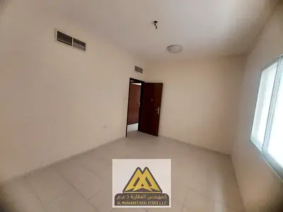Annual rent: 2BR apartment with separate living room, balcony, 2 bathrooms, central A/C, free maintenance, Al Nuaimiya 2, Ajman. Near Gulfa Bridge. AE