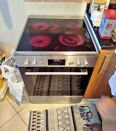 Bosch freestanding electric cooker featuring a stainless steel finish and a glass ceramic hob.