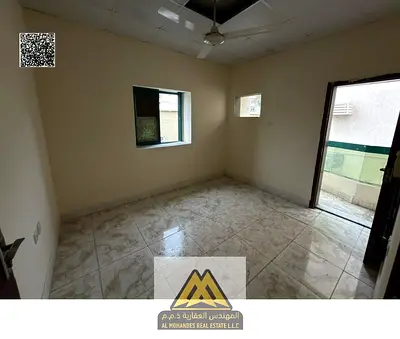 For rent: 1-bedroom apartment with hall in Al Rashidiya 1, Ajman. AED 22,000 yearly, 4 or 6 payments, balcony, spacious, opposite the Fish Market, no
