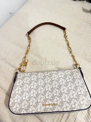 Michael Kors beige leather handbag - preowned, good condition